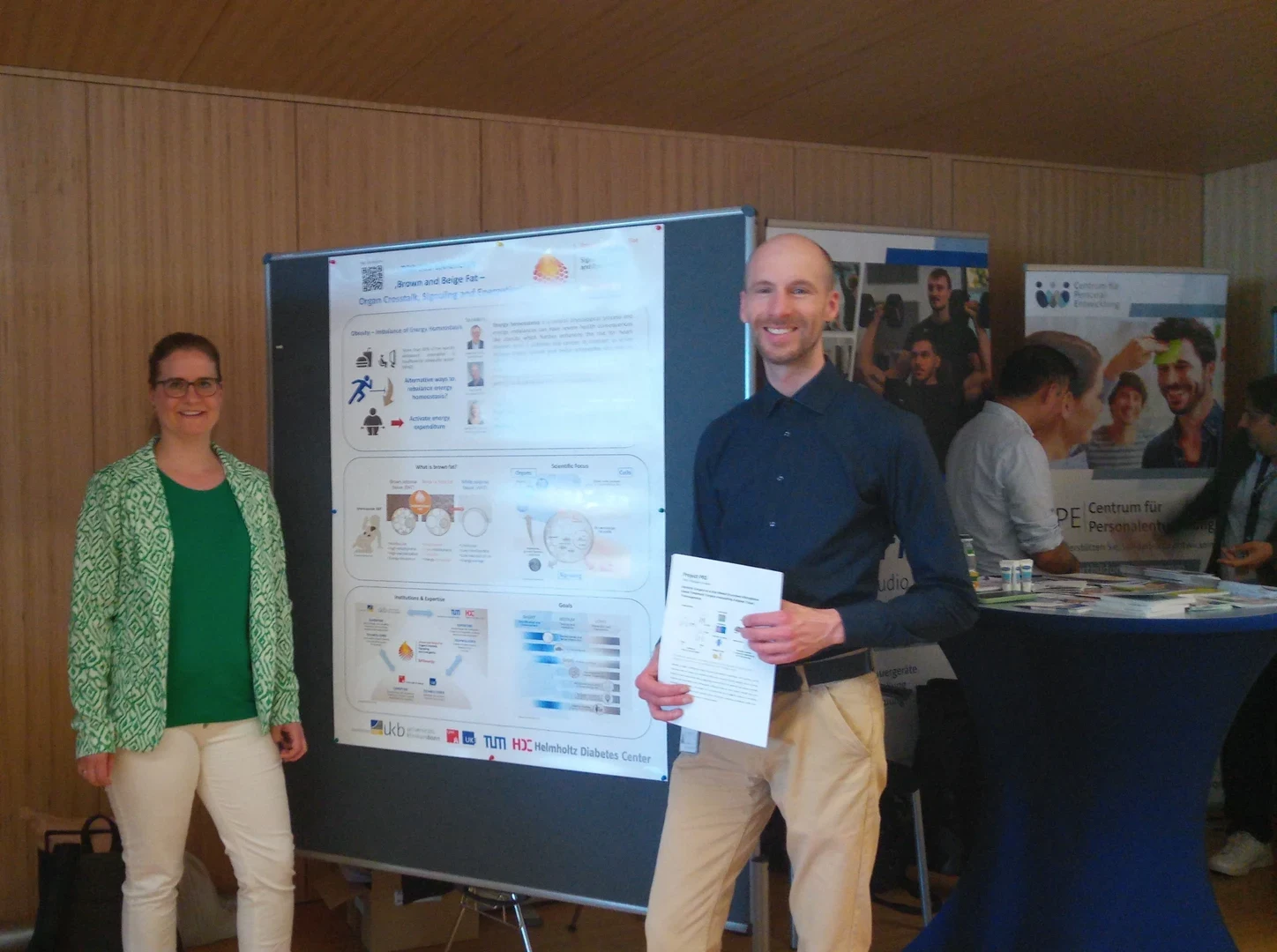 Prof. Wilhelm-Jüngling (left) and Dr. Stephan Altmann (right) in front of the TRR 333 BATenergy Poster